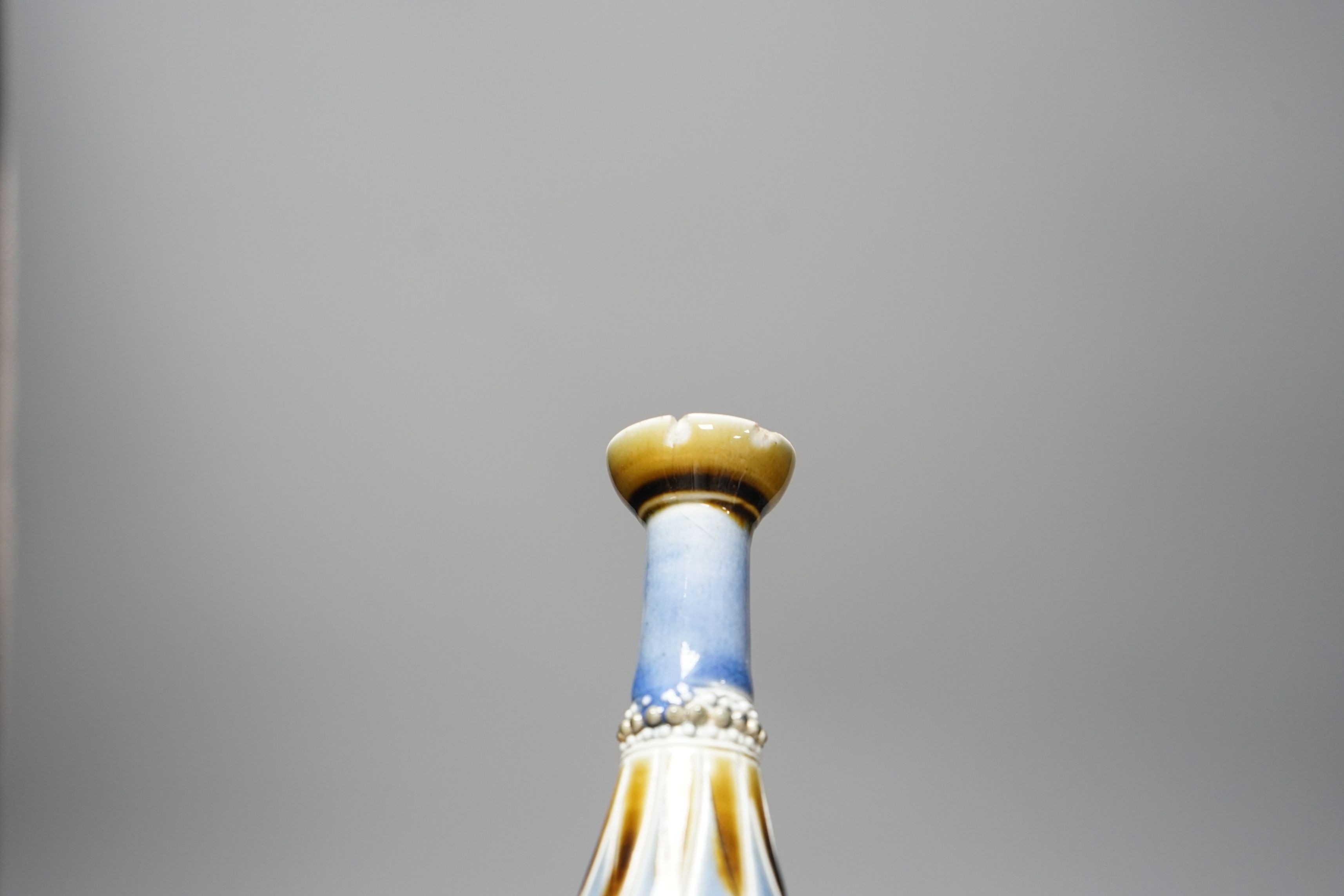 George Tinworth, a pair of Doulton Lambeth vases, stamped 1876, 20cm high